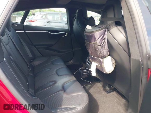 2016 Tesla Model S 90D z VIN 5YJSA1E4XGF171244, wystawiony jako IAAI lot #42584589 z przebiegiem 85 412 mil mil oraz . Historia ofert i sprzedaży dostępna na DreamBid. Obrazek 8.