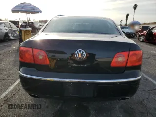 2006 Volkswagen Phaeton z VIN WVWAF03D268002733, wystawiony jako Copart lot #44980475 z przebiegiem 90 539 mil mil oraz Czysty tytuł • Clean title. Historia ofert i sprzedaży dostępna na DreamBid. Obrazek 6.