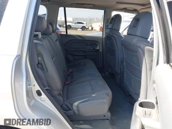 2005 Honda Pilot EX-L z VIN 2HKYF18515H550101, wystawiony jako IAAI lot #42182151 z przebiegiem 118 159 mil mil oraz . Historia ofert i sprzedaży dostępna na DreamBid. Obrazek 8.