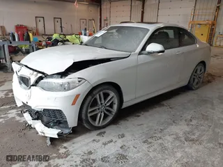 2016 BMW 2 Series 228i xDrive with VIN WBA1G9C53GVX97088, listed as a IAAI auction lot 41617710 with 72,978 mi miles. Bid and sale history available at carsss.com. Image 2.