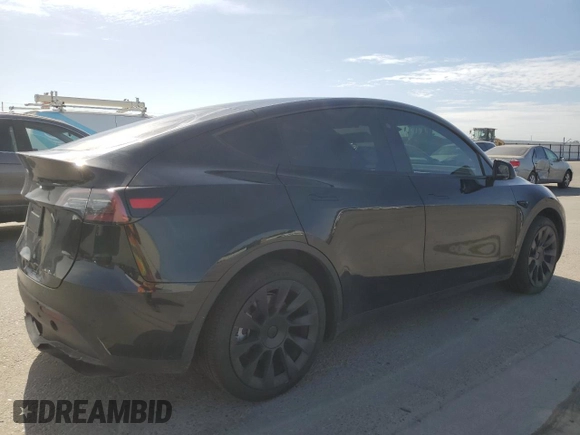 2024 Tesla Model Y with VIN 7SAYGDED0RF131495, listed as a Copart auction lot 56849765 with 10,120 mi miles and Salvage title. Bid and sale history available at DreamBid. Image 3.