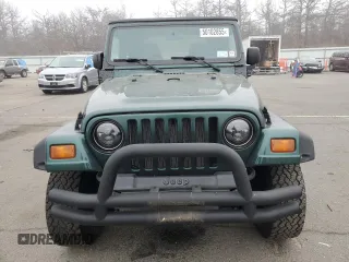 1999 Jeep Wrangler Sport z VIN 1J4FY19SXXP427968, wystawiony jako Copart lot #50102855 z przebiegiem 174 381 mil mil oraz Czysty tytuł • Clean title. Historia ofert i sprzedaży dostępna na DreamBid. Obrazek 5.