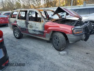 2002 Jeep Grand Cherokee z VIN 1J8GW38S72C159886, wystawiony jako Copart lot #77765704 z przebiegiem Nie podano mil oraz Szkoda całkowita • Salvage title. Historia ofert i sprzedaży dostępna na DreamBid. Obrazek 4.