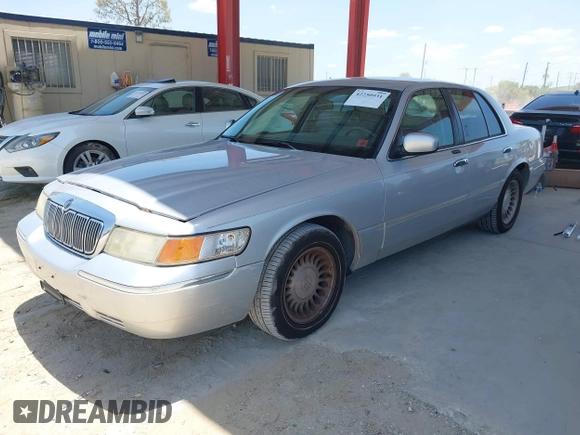 2001 Mercury Grand Marquis LS z VIN 2MEFM75W91X660964, wystawiony jako IAAI lot #42250931 z przebiegiem 74 462 mil mil oraz . Historia ofert i sprzedaży dostępna na DreamBid. Obrazek 2.