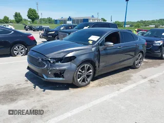 2020 Ford Fusion Titanium with VIN 3FA6P0K96LR173971, listed as a IAAI auction lot 42232469 with 82,474 mi miles and . Bid and sale history available at DreamBid. Image 2.