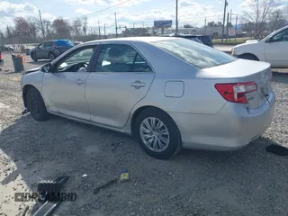 2014 Toyota Camry L with VIN 4T1BF1FK3EU301041, listed as a IAAI auction lot 41858386 with 136,998 mi miles and . Bid and sale history available at DreamBid. Image 3.