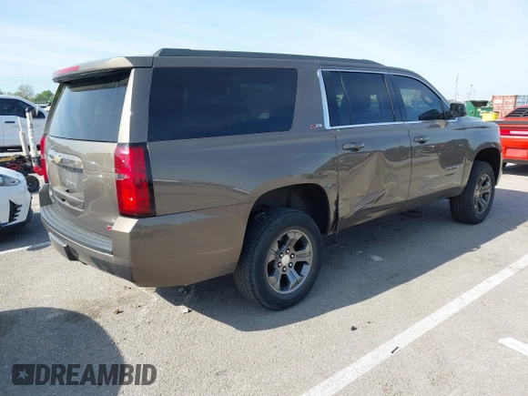 2016 Chevrolet Suburban LT z VIN 1GNSKHKC2GR289761, wystawiony jako IAAI lot #42086912 z przebiegiem 247 791 mil mil oraz . Historia ofert i sprzedaży dostępna na DreamBid. Obrazek 4.