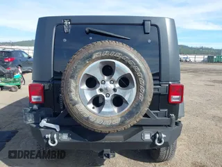 2009 Jeep Wrangler Unlimited X with VIN 1J4GA391X9L701403, listed as a IAAI auction lot 41890659 with 143,619 mi miles. Bid and sale history available at carsss.com. Image 16.