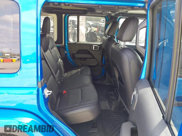 2023 Jeep Wrangler Sahara with VIN 1C4HJXEG4PW584800, listed as a IAAI auction lot 41908392 with 22,108 mi miles and . Bid and sale history available at DreamBid. Image 8.