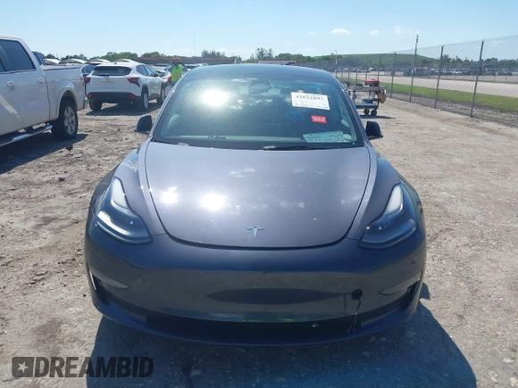 2023 Tesla Model 3 with VIN 5YJ3E1EA8PF626235, listed as a IAAI auction lot 42022893 with 30,333 mi miles and . Bid and sale history available at DreamBid. Image 13.