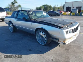 1984 Chevrolet Monte Carlo z VIN 1G1AZ37G0ER189601, wystawiony jako IAAI lot #41944983 z przebiegiem Nie podano mil oraz . Historia ofert i sprzedaży dostępna na DreamBid. Obrazek 1.