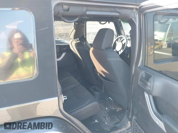 2017 Jeep Wrangler Unlimited Sahara with VIN 1C4BJWEG9HL507908, listed as a IAAI auction lot 41880209 with 99,773 mi miles. Bid and sale history available at carsss.com. Image 8.