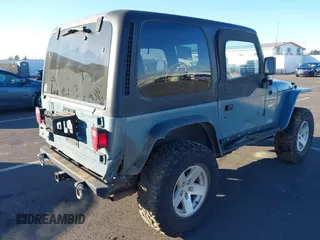 1998 Jeep Wrangler Sport with VIN 1J4FY19S4WP716469, listed as a IAAI auction lot 41506513 with 142,289 mi miles. Bid and sale history available at carsss.com. Image 4.