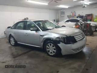 2009 Ford Taurus SE with VIN 1FAHP23W19G121737, listed as a IAAI auction lot 41802633 with 203,408 mi miles. Bid and sale history available at carsss.com. Image 1.