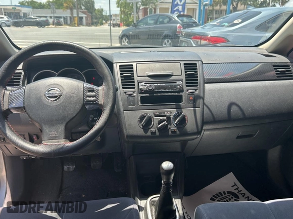 2009 Nissan Versa S with VIN 3N1BC13E19L499018, listed as a Copart auction lot 56711385 with 196,451 mi miles and Clean Title. Bid and sale history available at DreamBid. Image 9.