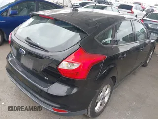 2014 Ford Focus SE with VIN 1FADP3K28EL375367, listed as a IAAI auction lot 42116798 with 129,380 mi miles. Bid and sale history available at carsss.com. Image 4.