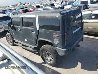 2003 Hummer H2 with VIN 5GRGN23U13H143781, listed as a Copart auction lot 77833264 with 0 mi miles and Salvage Title. Bid and sale history available at carsss.com. Image 2.