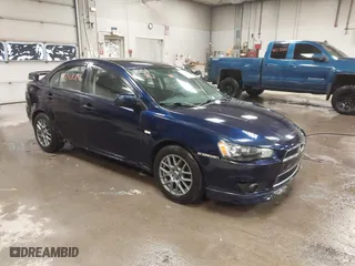 2013 Mitsubishi Lancer SE with VIN JA32V2FW9DU005616, listed as a IAAI auction lot 41247087 with 129,055 mi miles. Bid and sale history available at carsss.com. Image 1.