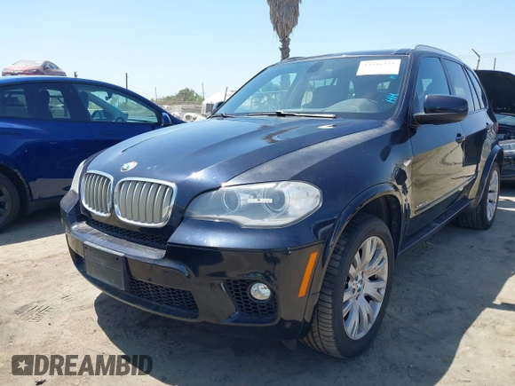 2013 BMW X5 xDrive50i with VIN 5UXZV8C5XD0C15908, listed as a IAAI auction lot 42536233 with 190,627 mi miles and . Bid and sale history available at DreamBid. Image 2.