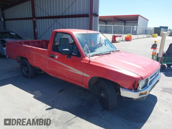 1992 Toyota Pickup DLX z VIN JT4RN82P8N5056666, wystawiony jako IAAI lot #42320829 z przebiegiem 147 032 mil mil oraz . Historia ofert i sprzedaży dostępna na DreamBid. Obrazek 1.
