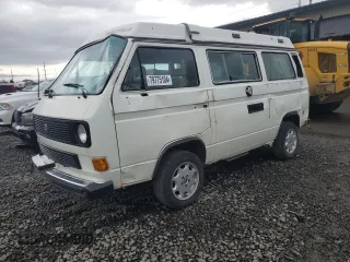 1986 Volkswagen Vanagon GL with VIN WV2ZB0258GH027387, listed as a Copart auction lot 79775104 with 236,406 mi miles and Salvage Title. Bid and sale history available at DreamBid. Image 1.