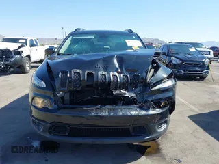 2016 Jeep Cherokee Altitude with VIN 1C4PJLAB2GW329397, listed as a IAAI auction lot 42294033 with 96,812 mi miles and . Bid and sale history available at DreamBid. Image 13.