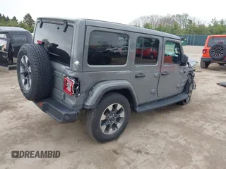 2022 Jeep Wrangler Unlimited Sahara with VIN 1C4HJXEG7NW138105, listed as a IAAI auction lot 42146898 with Not provided miles and . Bid and sale history available at DreamBid. Image 4.