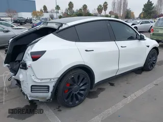 2022 Tesla Model Y Performance z VIN 7SAYGDEFXNF484838, wystawiony jako IAAI lot #41392095 z przebiegiem 8 728 mil mil oraz . Historia ofert i sprzedaży dostępna na DreamBid. Obrazek 4.
