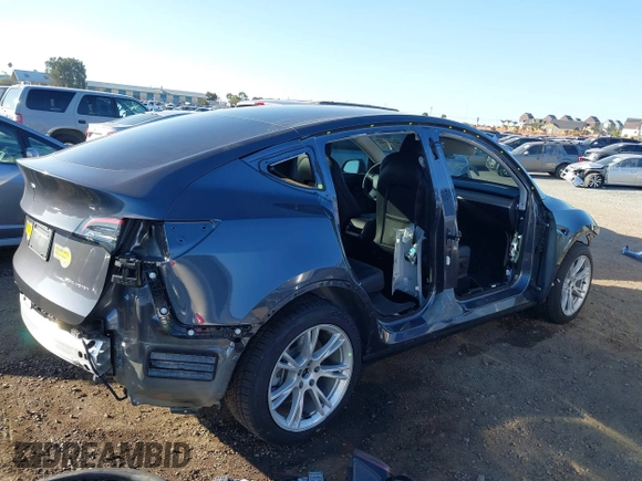 2021 Tesla Model Y Long Range with VIN 5YJYGDEE5MF191142, listed as a IAAI auction lot 41448514 with 71,626 mi miles. Bid and sale history available at carsss.com. Image 6.