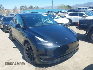 2023 Tesla Model Y Long Range z VIN 7SAYGDEE9PF591096, wystawiony jako IAAI lot #41762917 z przebiegiem 22 582 mil mil oraz . Historia ofert i sprzedaży dostępna na DreamBid. Obrazek 1.