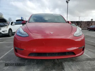 2021 Tesla Model Y Long Range with VIN 5YJYGDEEXMF217816, listed as a Copart auction lot 51008665 with 57,392 mi miles and Salvage Title. Bid and sale history available at DreamBid. Image 5.