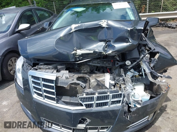 2013 Cadillac XTS Luxury z VIN 2G61P5S34D9109189, wystawiony jako IAAI lot #42242533 z przebiegiem 178 234 mil mil oraz . Historia ofert i sprzedaży dostępna na DreamBid. Obrazek 12.