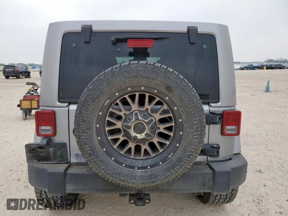 2014 Jeep Wrangler Unlimited Rubicon с VIN 1C4HJWFG3EL322449, выставлен на аукционе Copart как лот 57187665 с пробегом 122 469 миль миль и Списание • Salvage title. История ставок и продаж доступна на DreamBid. Изображение 6.
