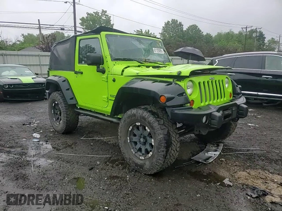 2012 Jeep Wrangler Sport with VIN 1C4AJWAG2CL233722, listed as a Copart auction lot 61125095 with 49,864 mi miles and Salvage title. Bid and sale history available at DreamBid. Image 13.