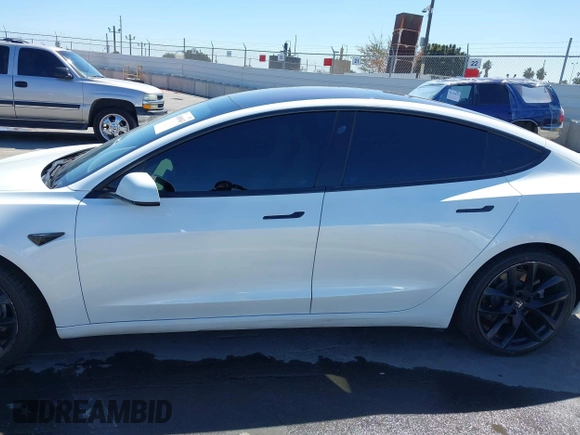 2019 Tesla Model 3 Mid Range with VIN 5YJ3E1EA5KF327181, listed as a IAAI auction lot 41860943 with 157,335 mi miles and . Bid and sale history available at DreamBid. Image 14.