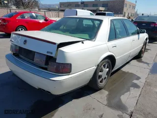 1996 Cadillac Seville Touring STS with VIN 1G6KY5298TU815539, listed as a IAAI auction lot 41665242 with 151,736 mi miles. Bid and sale history available at carsss.com. Image 4.
