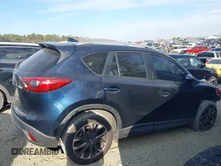 2016 Mazda CX-5 Grand Touring with VIN JM3KE2DY1G0708572, listed as a IAAI auction lot 41685298 with 109,427 mi miles. Bid and sale history available at carsss.com. Image 13.