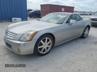 2004 Cadillac XLR z VIN 1G6YV34A945601007, wystawiony jako Copart lot #77077394 z przebiegiem Nie podano mil oraz Szkody całkowita. Historia ofert i sprzedaży dostępna na DreamBid. Obrazek 1.