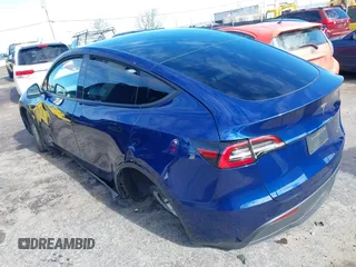 2022 Tesla Model Y Long Range with VIN 7SAYGDEE6NF318372, listed as a IAAI auction lot 41526857 with 26,083 mi miles and . Bid and sale history available at carsss.com. Image 3.