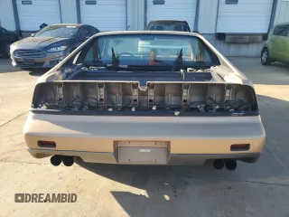 1987 Pontiac Fiero GT z VIN 1G2PG119XHP200243, wystawiony jako Copart lot #74389864 z przebiegiem 109 478 mil mil oraz Tytuł czysty. Historia ofert i sprzedaży dostępna na DreamBid. Obrazek 6.