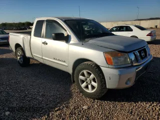2010 Nissan Titan SE with VIN 1N6AA0CA5AN308613, listed as a Copart auction lot 82812894 with 98,887 mi miles and Salvage Title. Bid and sale history available at carsss.com. Image 4.