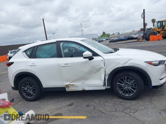 2019 Mazda CX-5 Sport with VIN JM3KFABM4K1565787, listed as a IAAI auction lot 42054585 with 80,580 mi miles and . Bid and sale history available at DreamBid. Image 13.