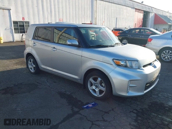 2015 Scion xB with VIN JTLZE4FE7FJ073828, listed as a IAAI auction lot 41857967 with 56,242 mi miles. Bid and sale history available at carsss.com. Image 1.