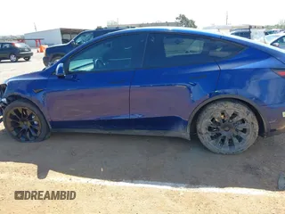 2020 Tesla Model Y Long Range with VIN 5YJYGDEF4LF000494, listed as a IAAI auction lot 41894856 with 118,638 mi miles and . Bid and sale history available at DreamBid. Image 13.