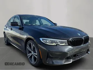 2021 BMW 3 Series 330i with VIN 3MW5R1J04MBB48483, listed as a Copart auction lot 50515195 with 128,555 mi miles and Clean Title. Bid and sale history available at carsss.com. Image 1.