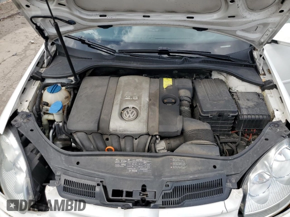 2009 Volkswagen Rabbit S with VIN WVWDB71K79W085935, listed as a Copart auction lot 60697594 with 102,780 mi miles and Salvage title. Bid and sale history available at DreamBid. Image 11.