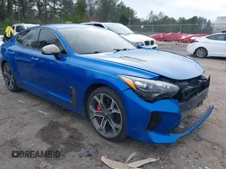 2019 Kia Stinger GT with VIN KNAE35LC7K6055087, listed as a IAAI auction lot 41574883 with 107,639 mi miles. Bid and sale history available at carsss.com. Image 1.