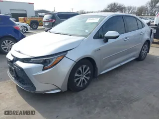 2020 Toyota Corolla Hybrid LE with VIN JTDEBRBE9LJ019691, listed as a IAAI auction lot 41600237 with 79,969 mi miles. Bid and sale history available at carsss.com. Image 2.