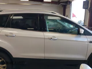 2016 Ford Escape Titanium with VIN 1FMCU9J94GUC28648, listed as a IAAI auction lot 42043761 with 82,509 mi miles and . Bid and sale history available at DreamBid. Image 13.