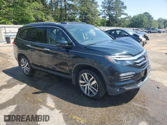 2017 Honda Pilot Touring z VIN 5FNYF6H93HB051982, wystawiony jako Copart lot #53390535 z przebiegiem Nie podano mil oraz Szkoda całkowita • Salvage title. Historia ofert i sprzedaży dostępna na DreamBid. Obrazek 4.
